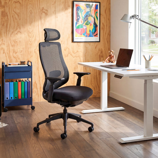COLAMY ATLAS-01 black high back mesh office chair beside a height adjustable desk