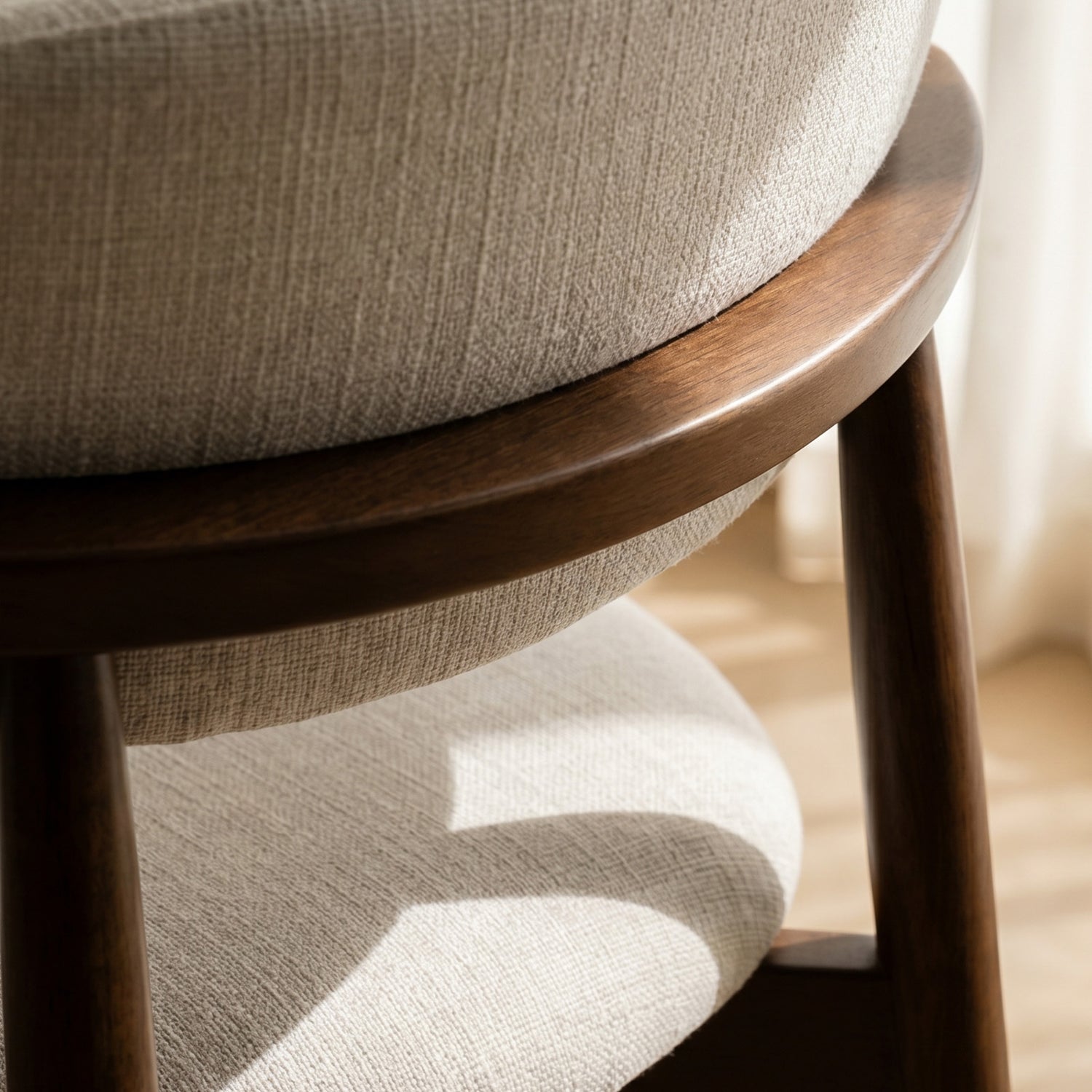 Close-up of COLAMY ARLA beige fabric upholstery and wooden backrest detail