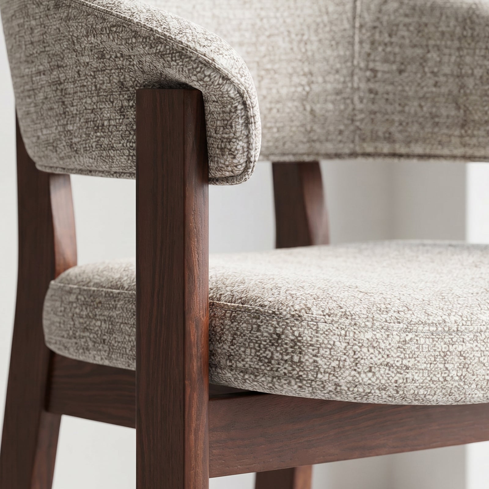 Detailed view of the Halo Prime upholstered dining chair with a padded seat and dark solid oak frame