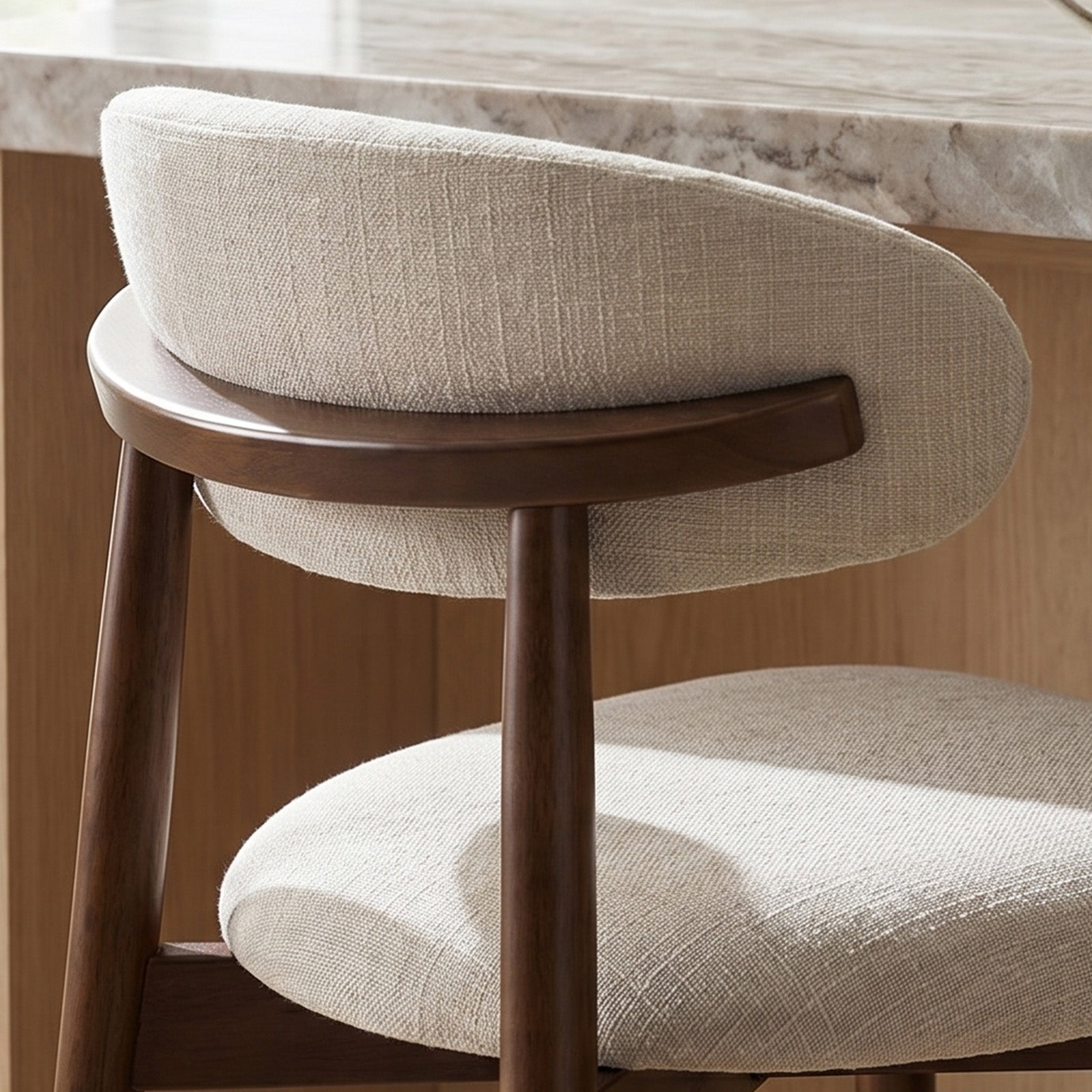 Rear close-up of COLAMY ARLA beige counter stool with upholstered back and wooden support rail