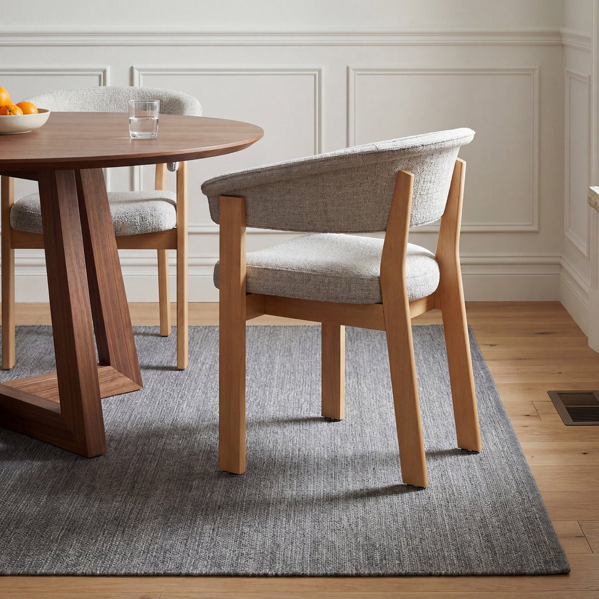 Rear view of COLAMY Halo Luxe beige upholstered dining chair with natural solid oak frame
