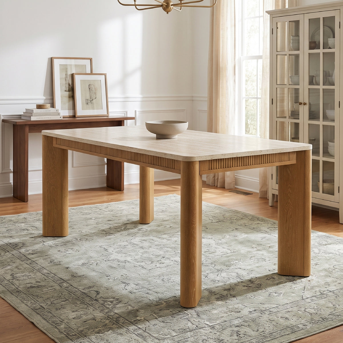 colamy verse 63 inch travertine inspired dining table in warm transitional dining room