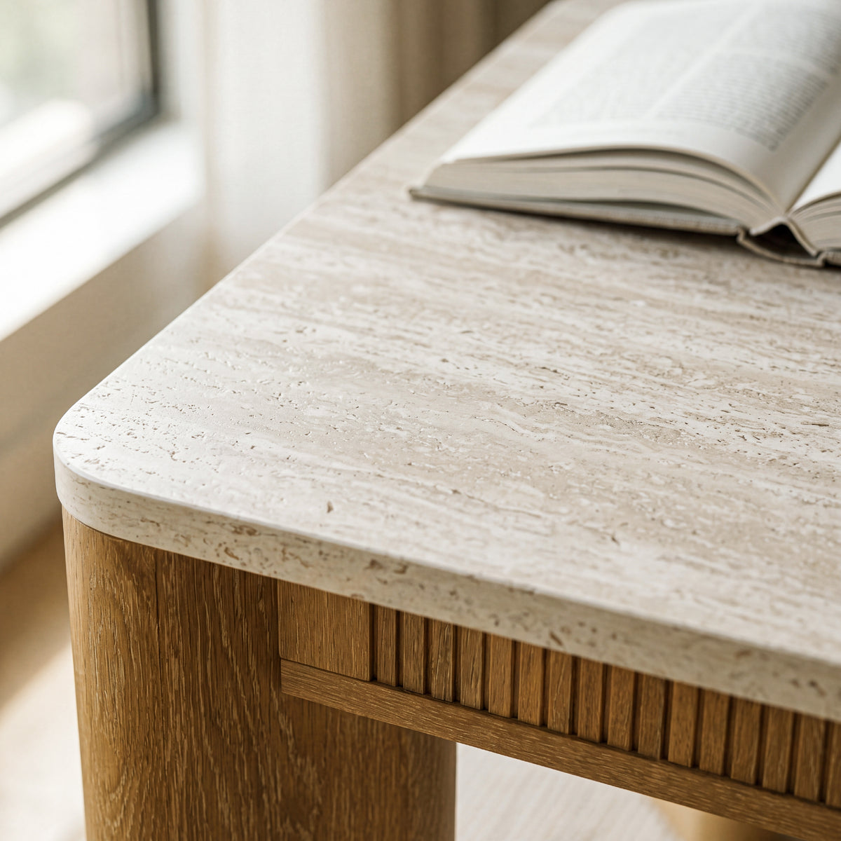 colamy verse faux travertine dining table top texture close up with book