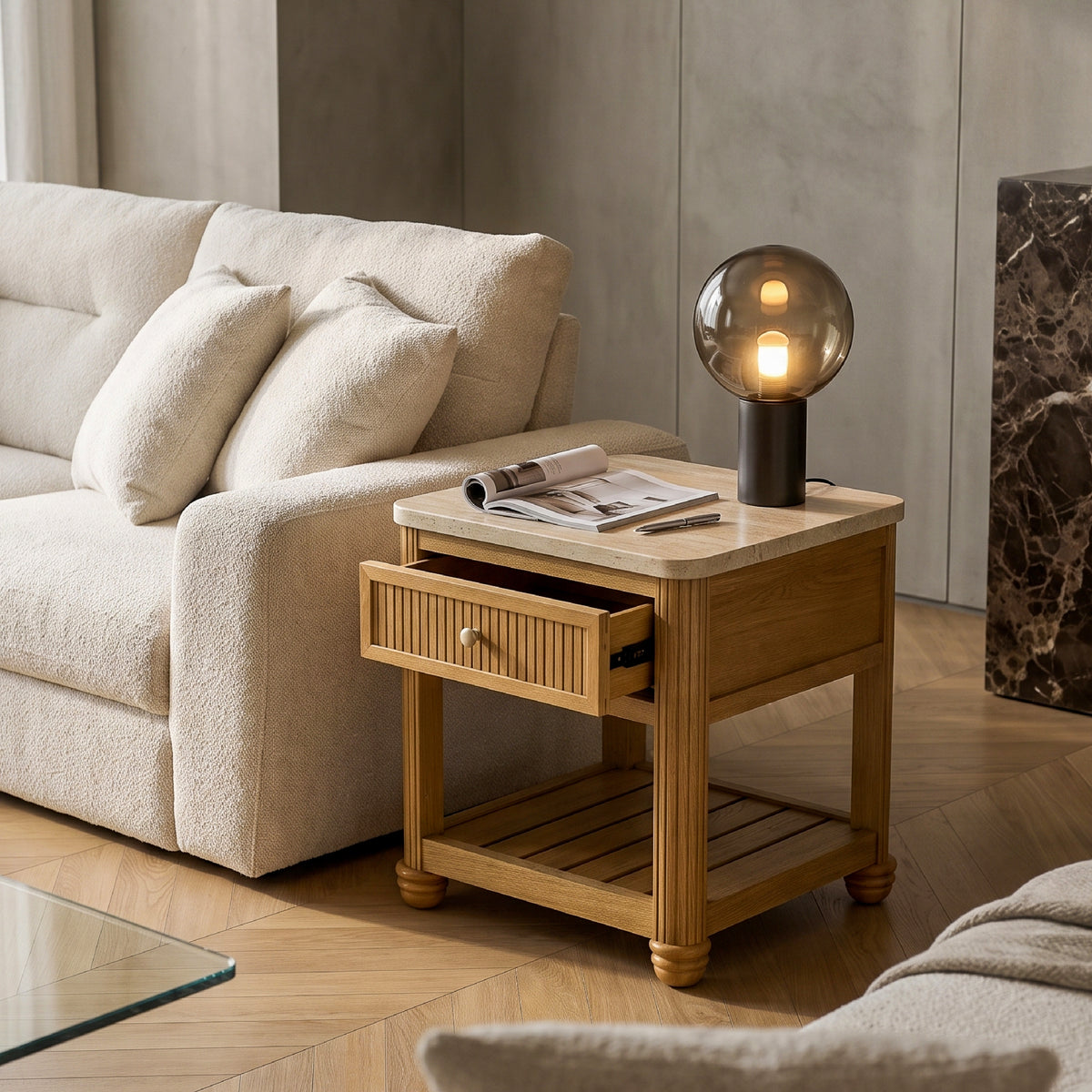 reading nook side table with storage beside a boucle sofa and accent chair in an apartment living room